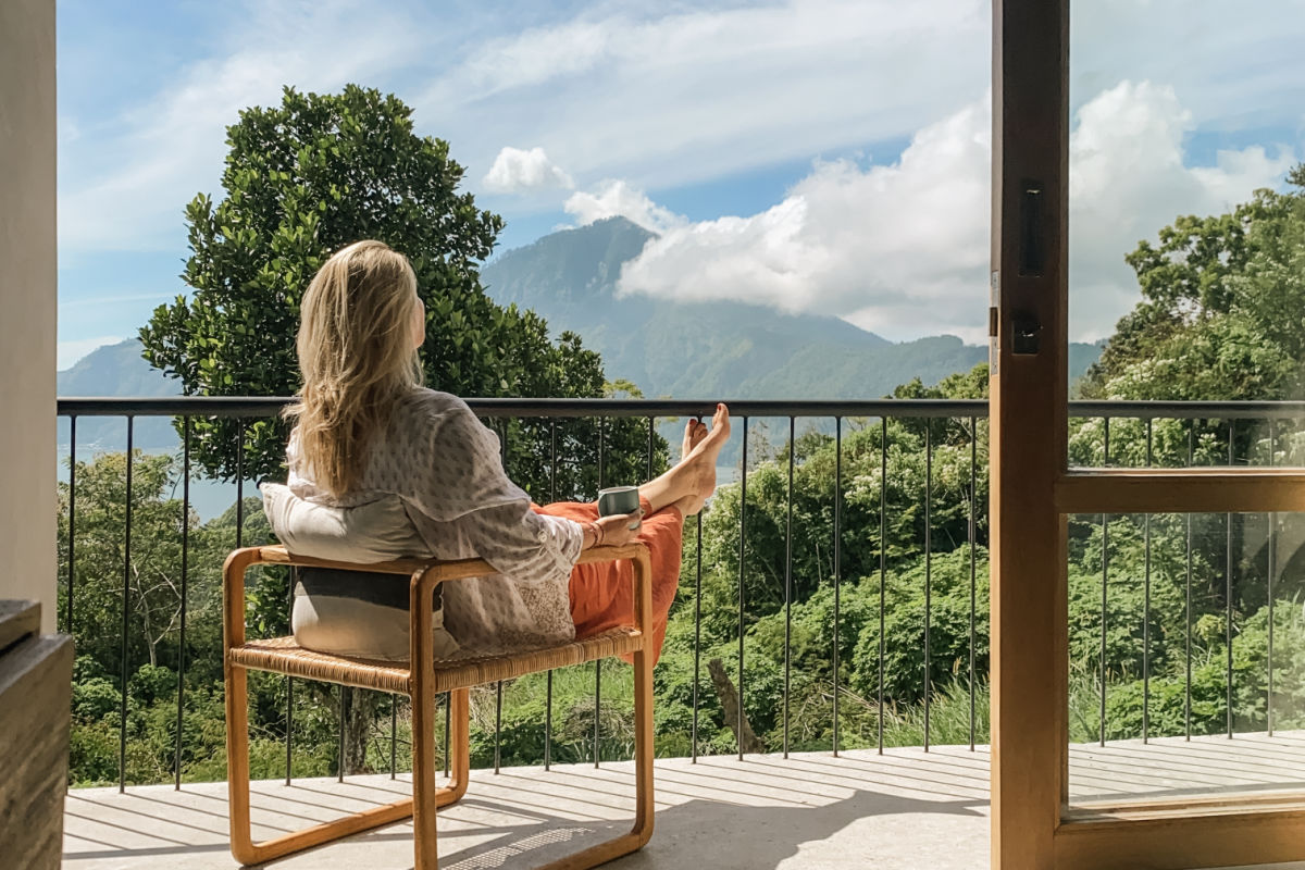 Woman Looks At View of Mount Batur in Bali fFrom Hotel Veranda.jpg