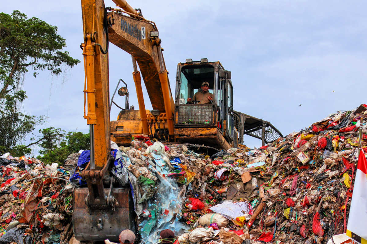 Digger in Landfill in Indonesia.jpg