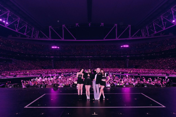 Blackpink poses for a photo on the stage during the Deadline world tour on Jan. 24, 2026, at Kai Tak Stadium in Hong Kong.