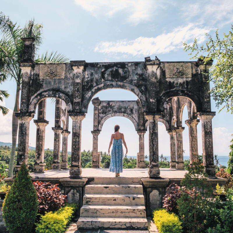 Taman-Ujung-Palace-Woman-Stands-Bali